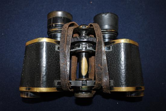 A pair of German WWI binoculars, two helmet straps and four pairs of Africa core goggles